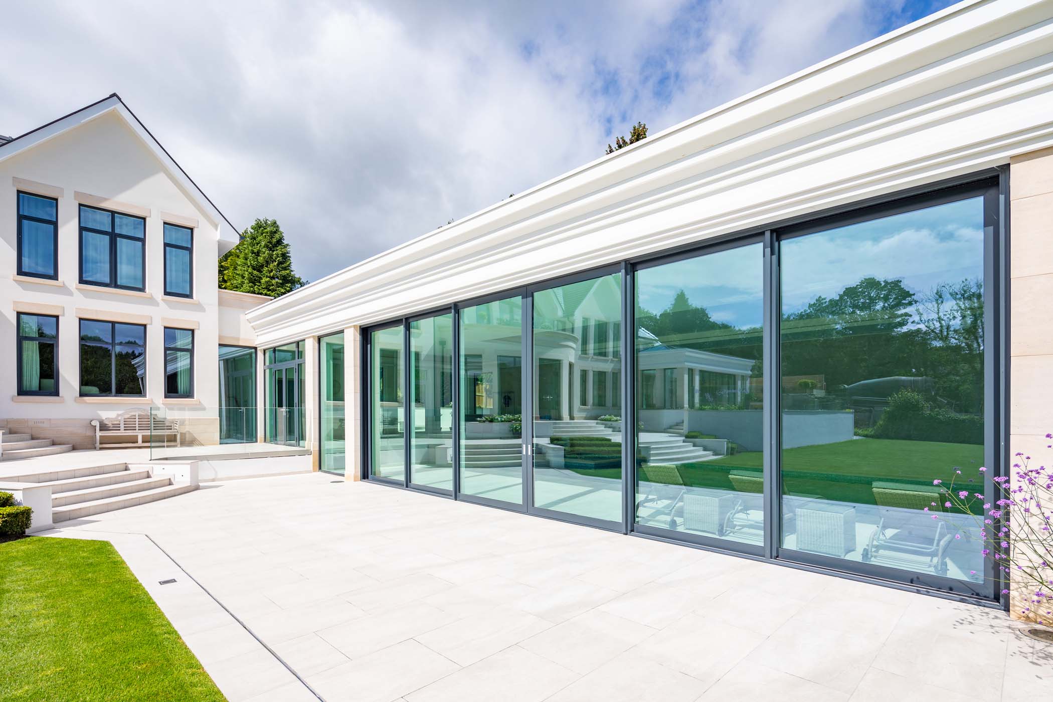 a home with large glass patio doors